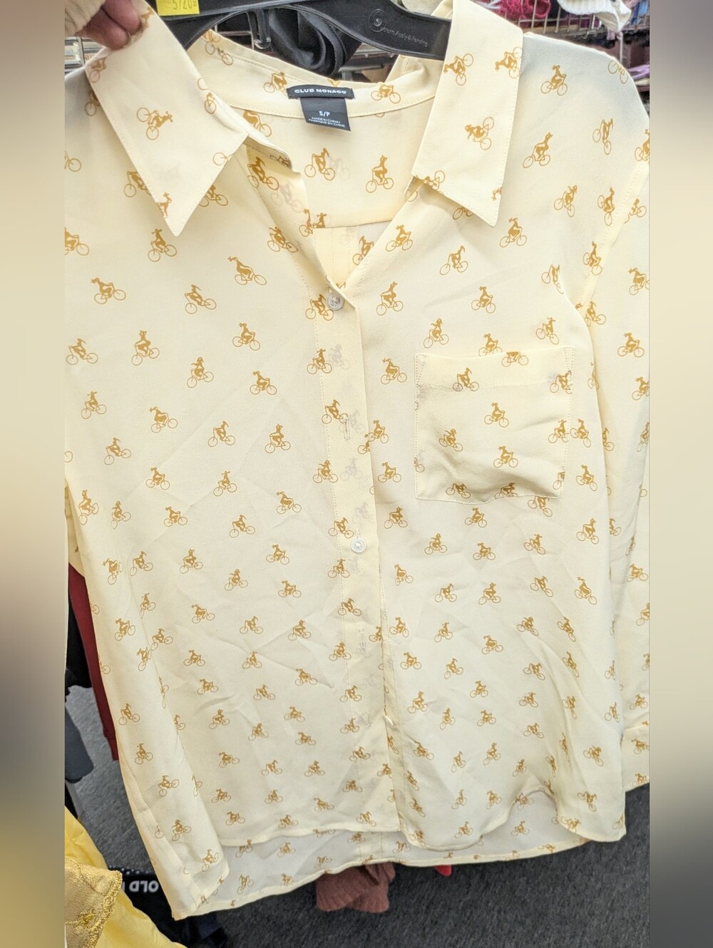 Club Monaco 100% Silk Blouse in a beautiful pale yellow with a subtle whimsical